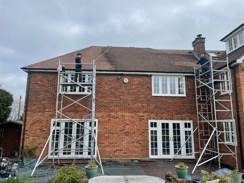 Roof cleaning carried out safely from scaffold towers by The Roof Moss Cleaners in Hoddesdon